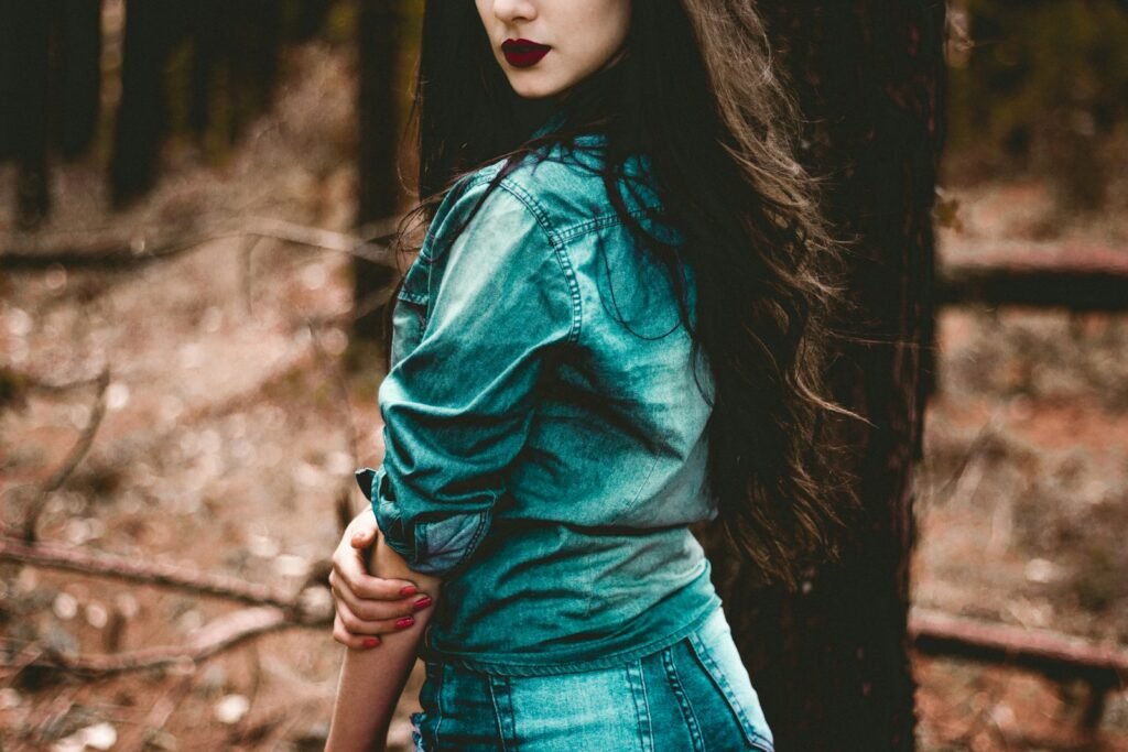 Woman in a casual denim dress for a laid-back party outfit
