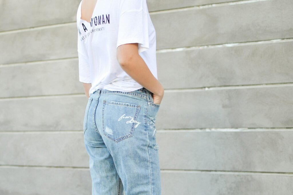 Woman styling a white shirt with denim jeans, an easy outfit combination