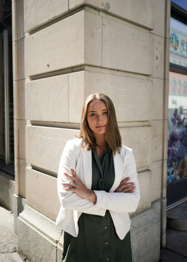 Woman in a white blazer styled for a business casual office outfit