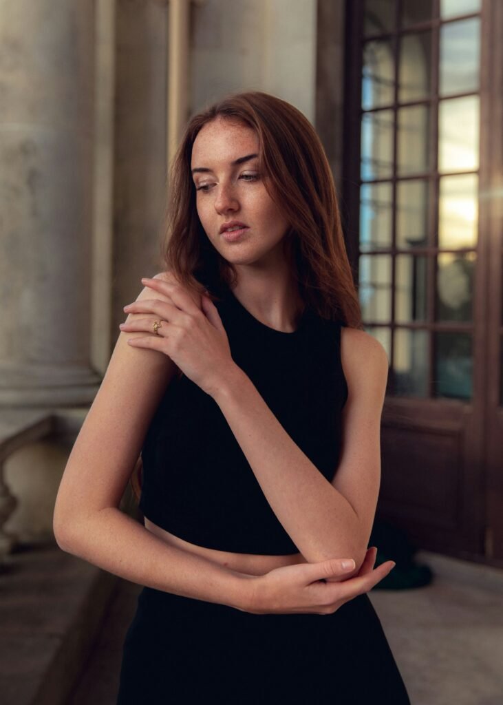 Woman in a black cocktail dress for evening dress code